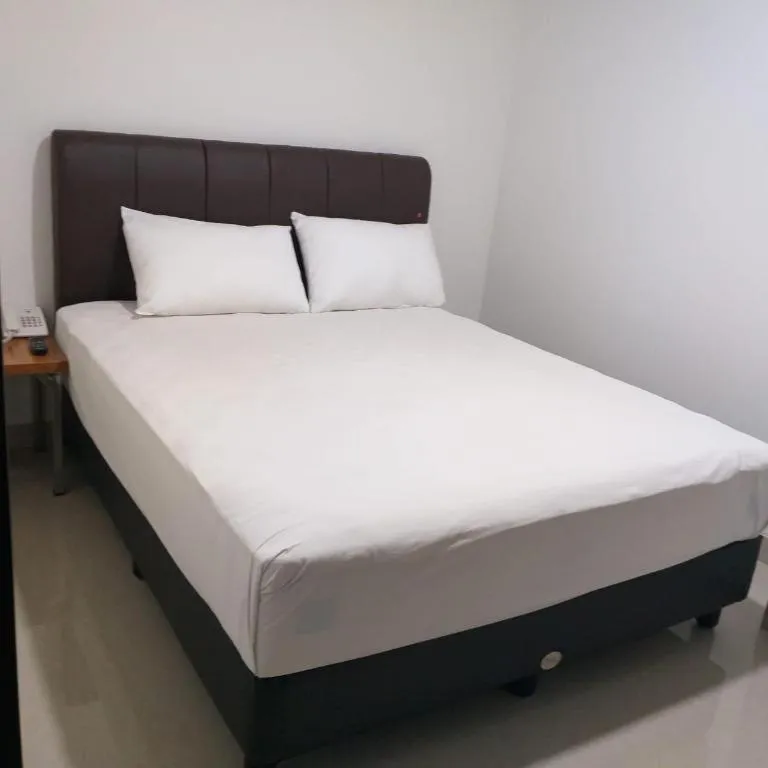 Bed in I&M Hotel Billiard