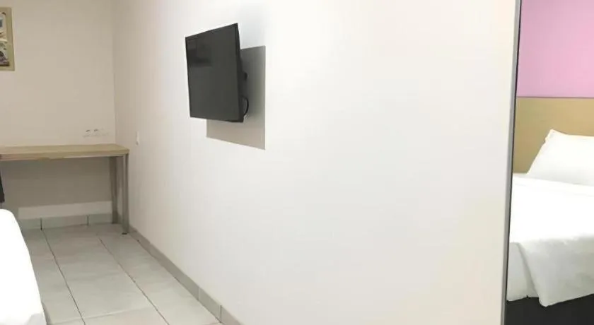 Bed in I&M Hotel Billiard