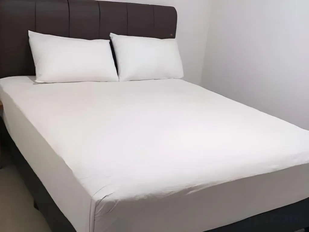 Bed in I&M Hotel Billiard