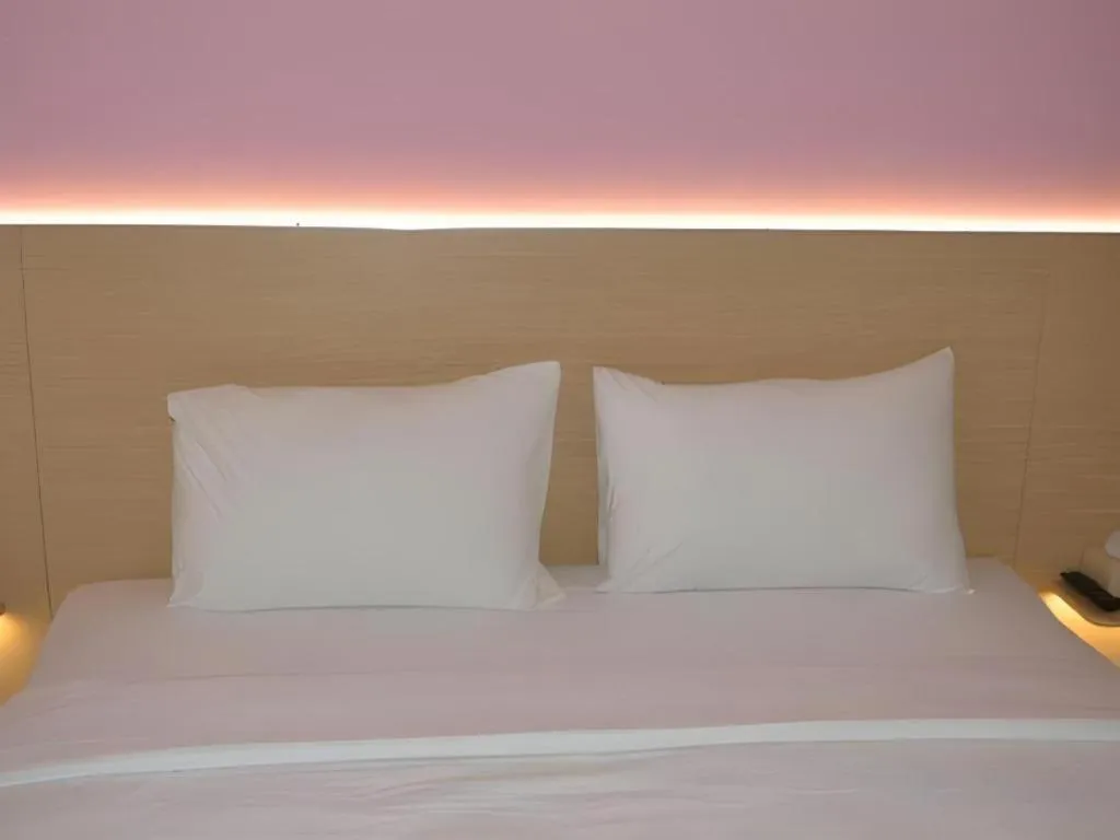 Bed in I&M Hotel Billiard