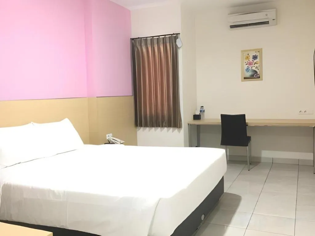 Bed in I&M Hotel Billiard