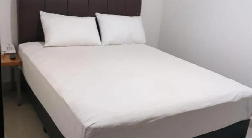 Bed in I&M Hotel Billiard