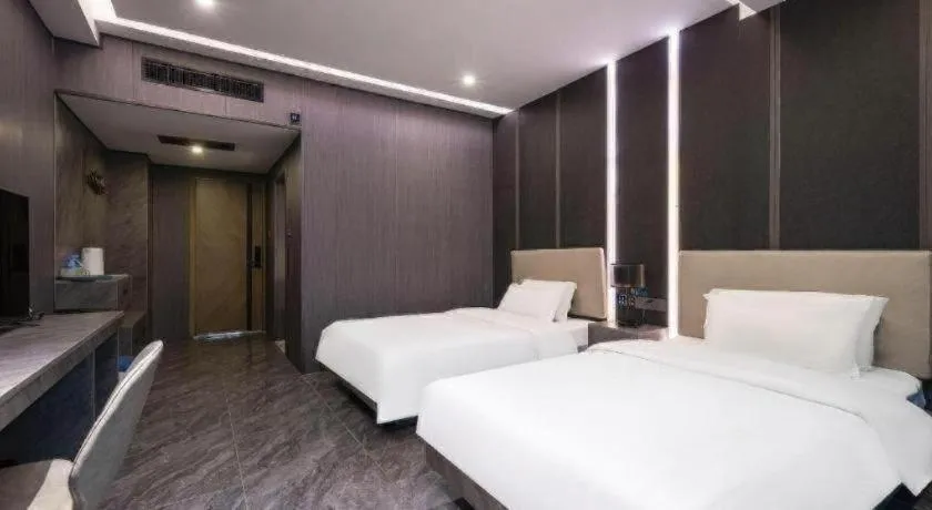 Bed in Haikou Kai Wei Hotel