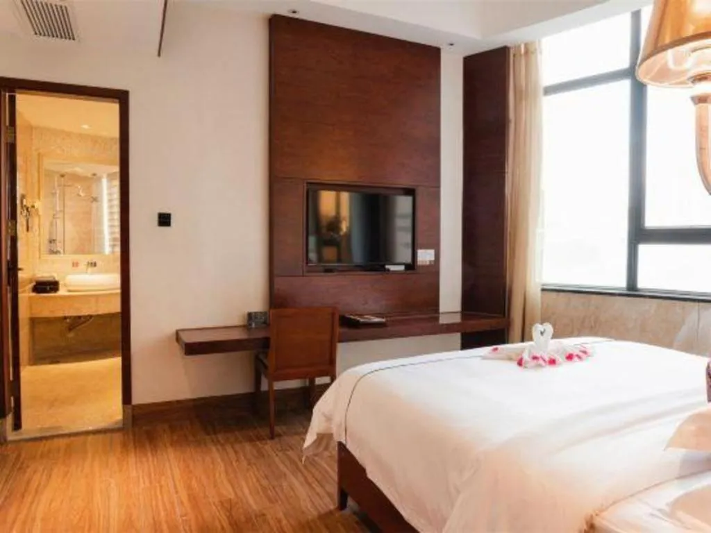 Bed in Haikou Kai Wei Hotel