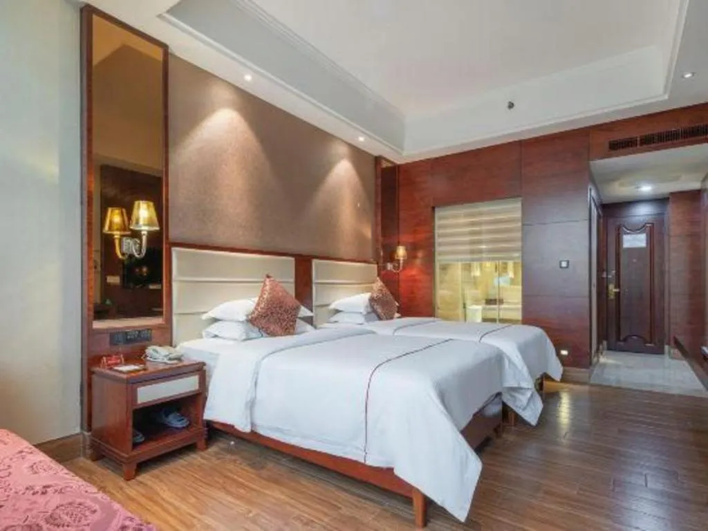 Bed in Haikou Kai Wei Hotel