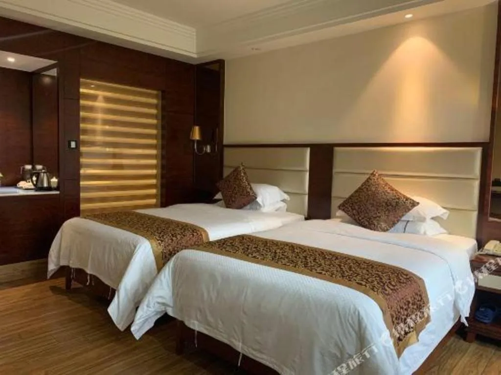 Bed in Haikou Kai Wei Hotel