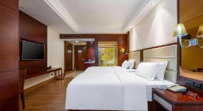 Bed in Haikou Kai Wei Hotel