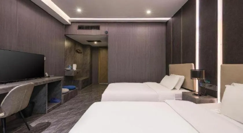 Bed in Haikou Kai Wei Hotel