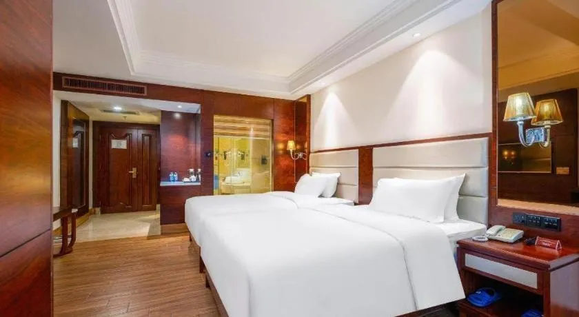 Bed in Haikou Kai Wei Hotel