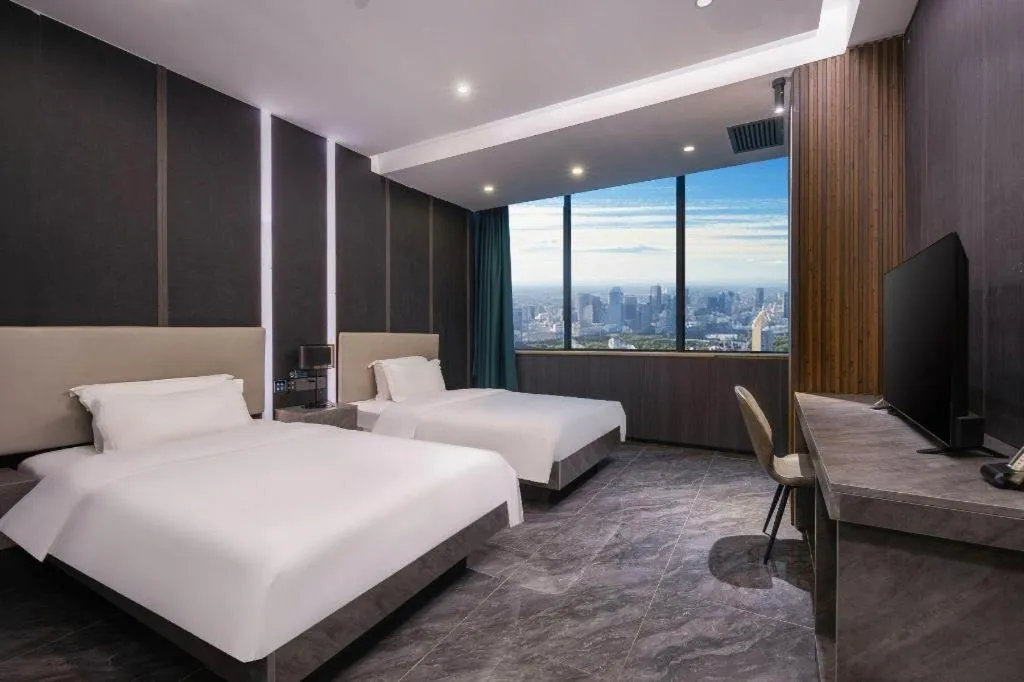 Bed in Haikou Kai Wei Hotel