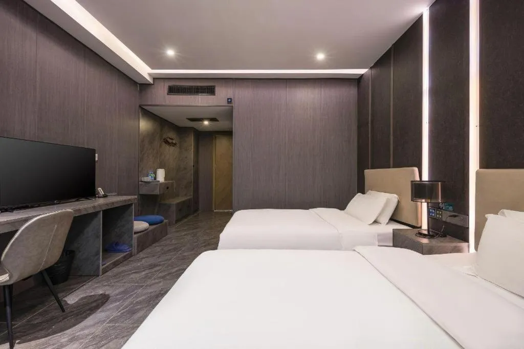 Bed in Haikou Kai Wei Hotel