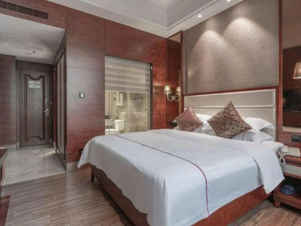 Bed in Haikou Kai Wei Hotel