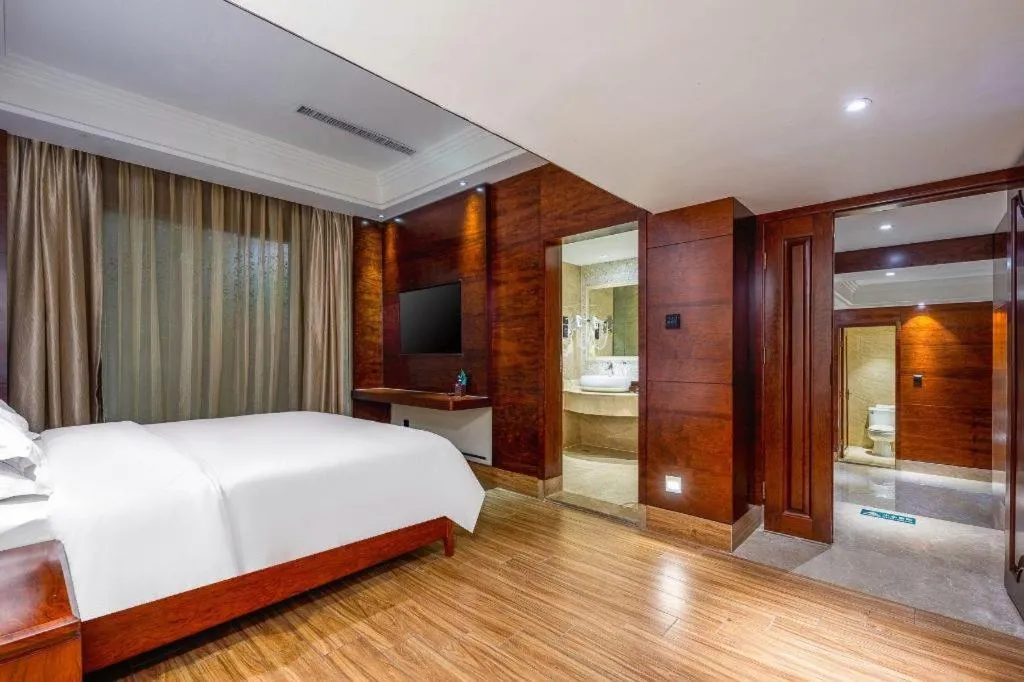 Bed in Haikou Kai Wei Hotel