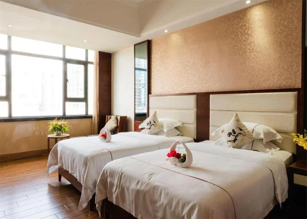 Bed in Haikou Kai Wei Hotel