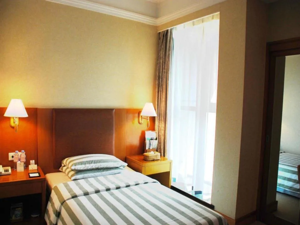 Bed in Culture Plaza Hotel