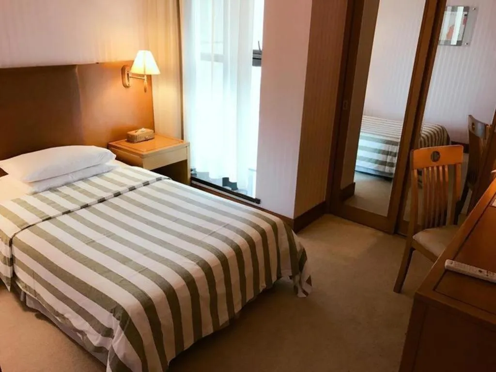 Bed in Culture Plaza Hotel