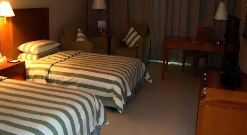 Bed in Culture Plaza Hotel