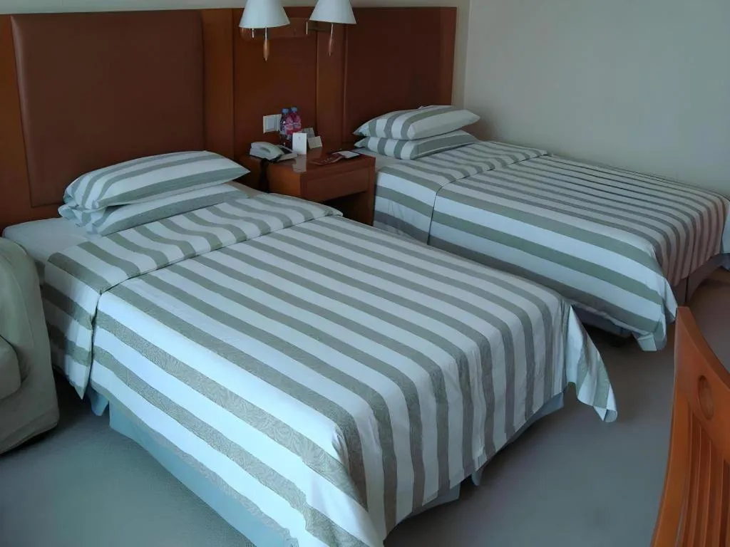 Bed in Culture Plaza Hotel