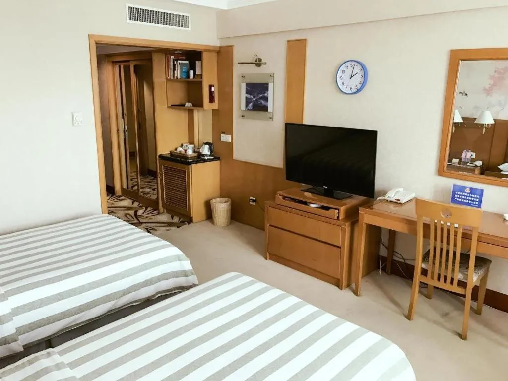 Bed in Culture Plaza Hotel