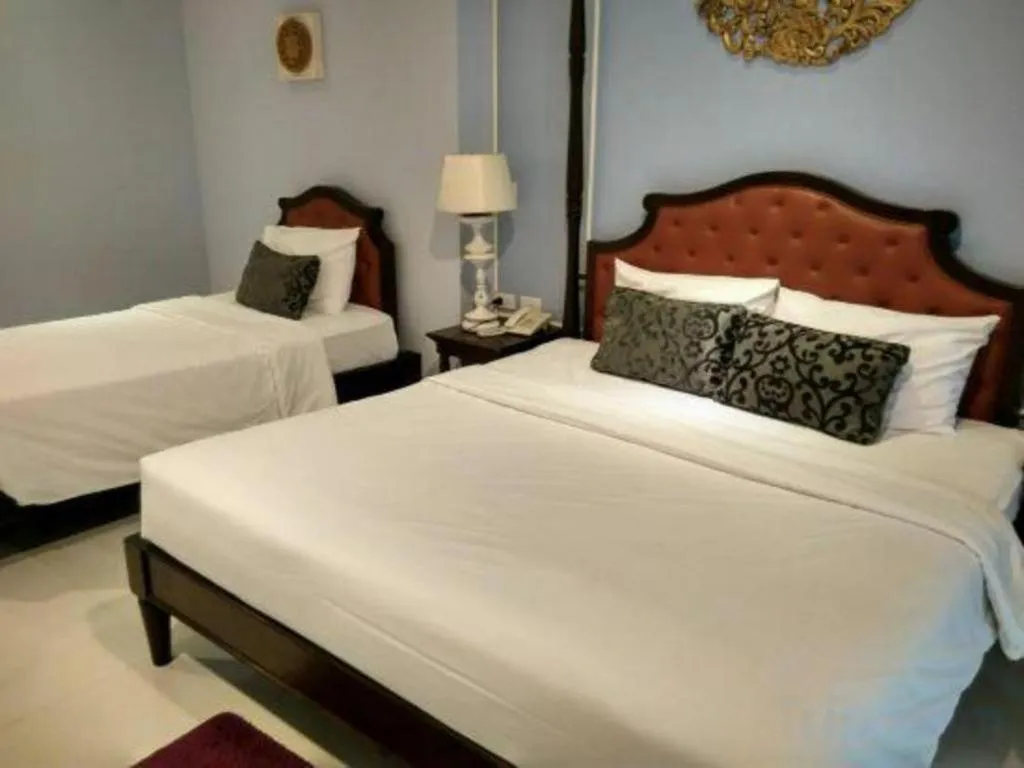 Bed in Khamthana the Colonial Hotel Chiangrai