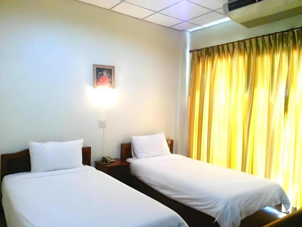 Bed in Sisavath Hotel