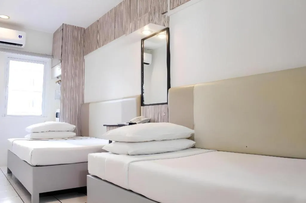 Bed in Majestic Hotel Manila - Formerly Octagon Mansion Hotel Manila