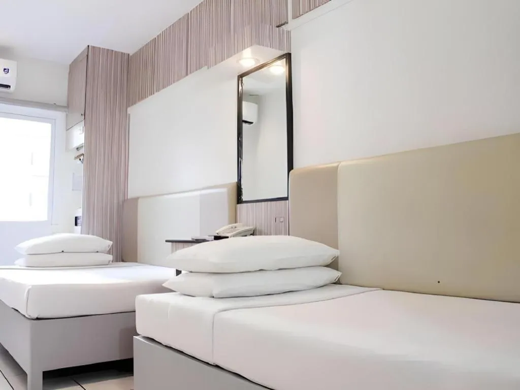 Bed in Majestic Hotel Manila - Formerly Octagon Mansion Hotel Manila