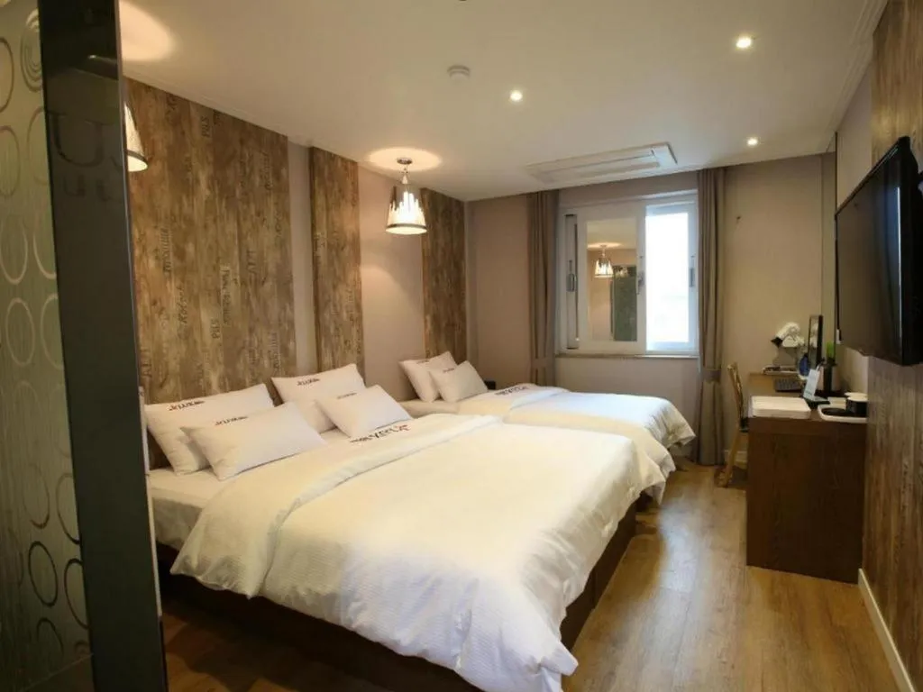 Bed in Jeju Lux Hotel