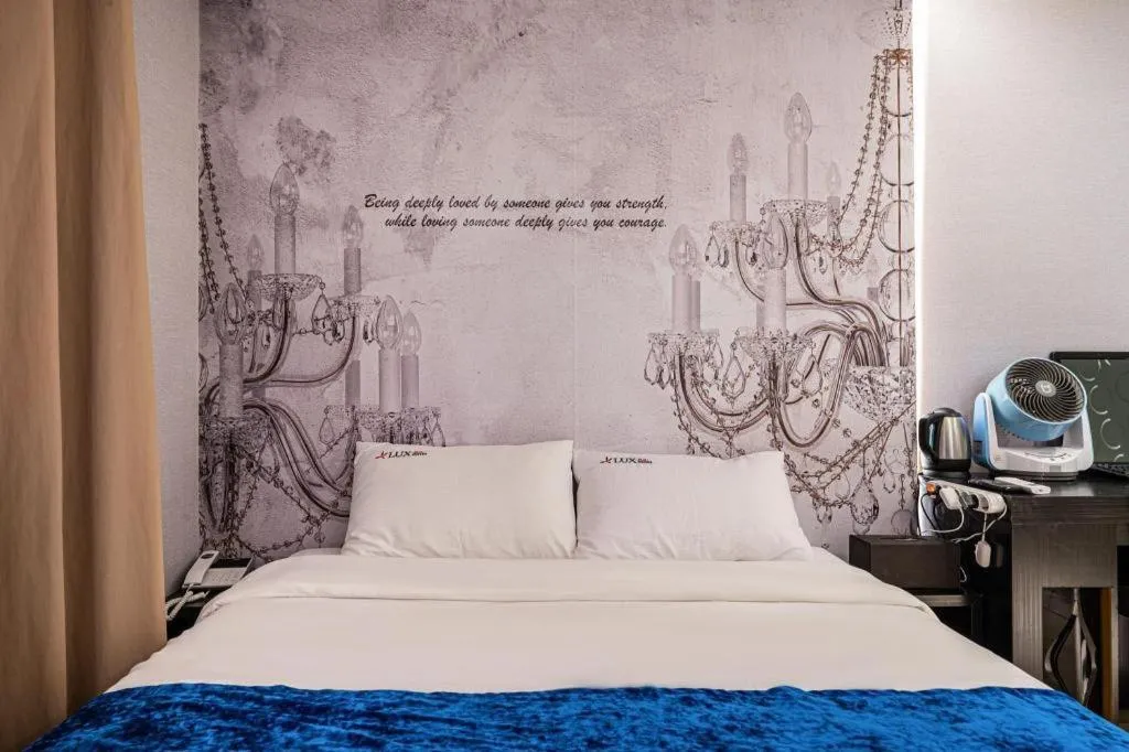 Bed in Jeju Lux Hotel