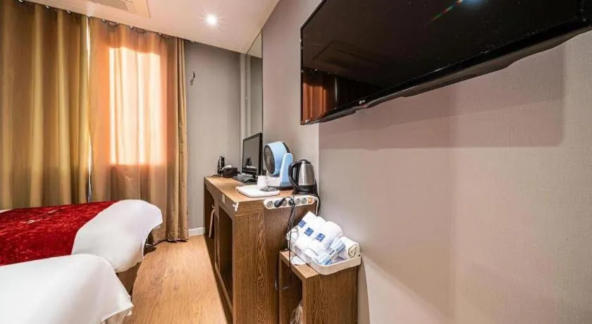 Bed in Jeju Lux Hotel