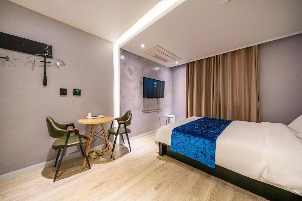 Bed in Jeju Lux Hotel