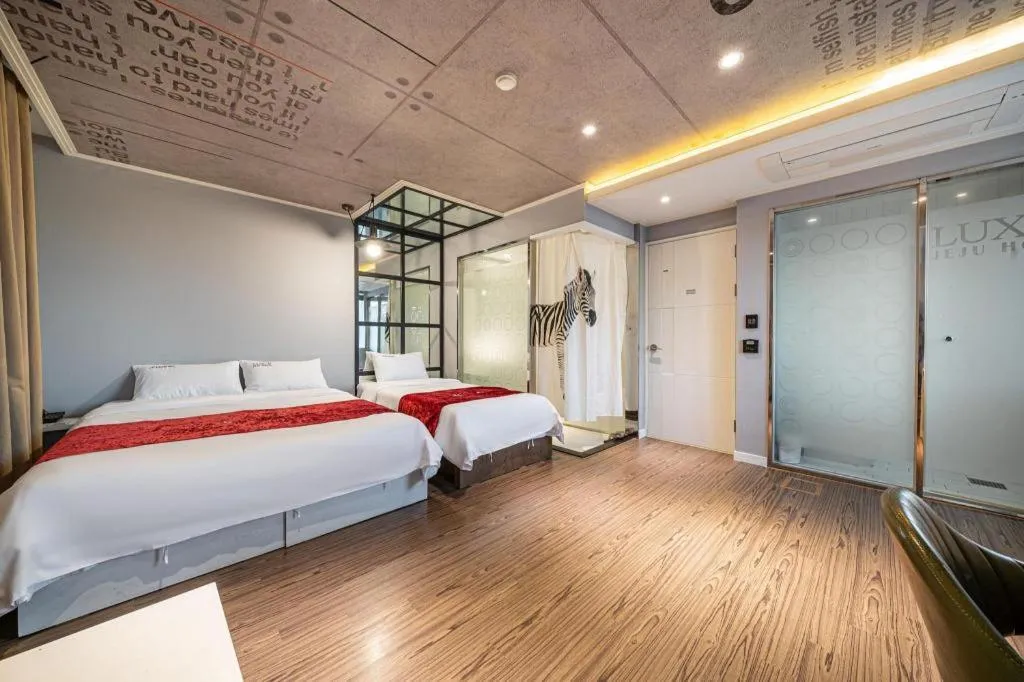 Bed in Jeju Lux Hotel