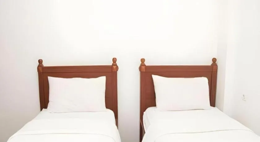 Bed in Hotel Amira Pasteur