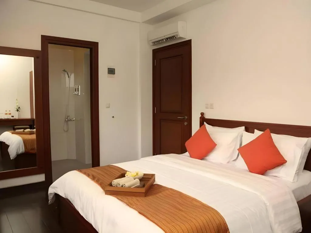 Bed in Hotel Amira Pasteur