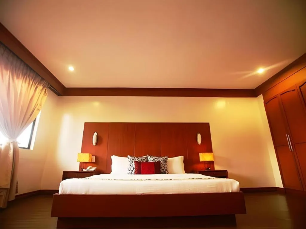 Bed in Naga Land Hotel