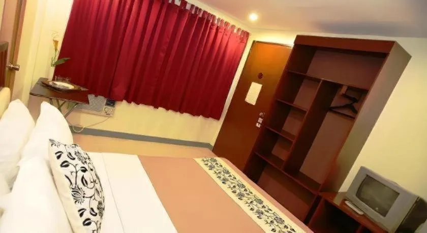 Bed in Naga Land Hotel