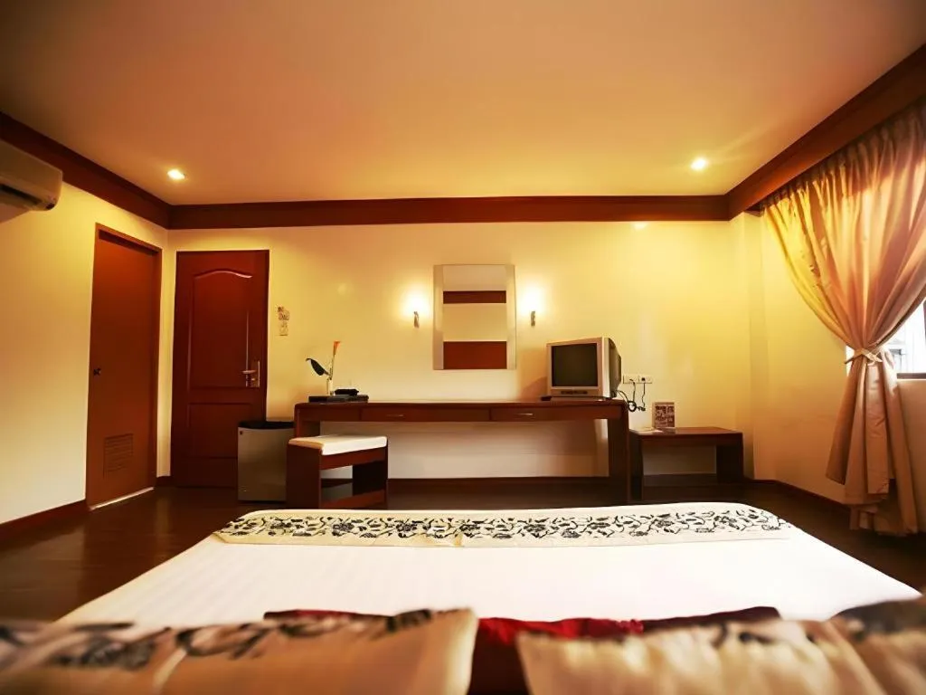 Bed in Naga Land Hotel