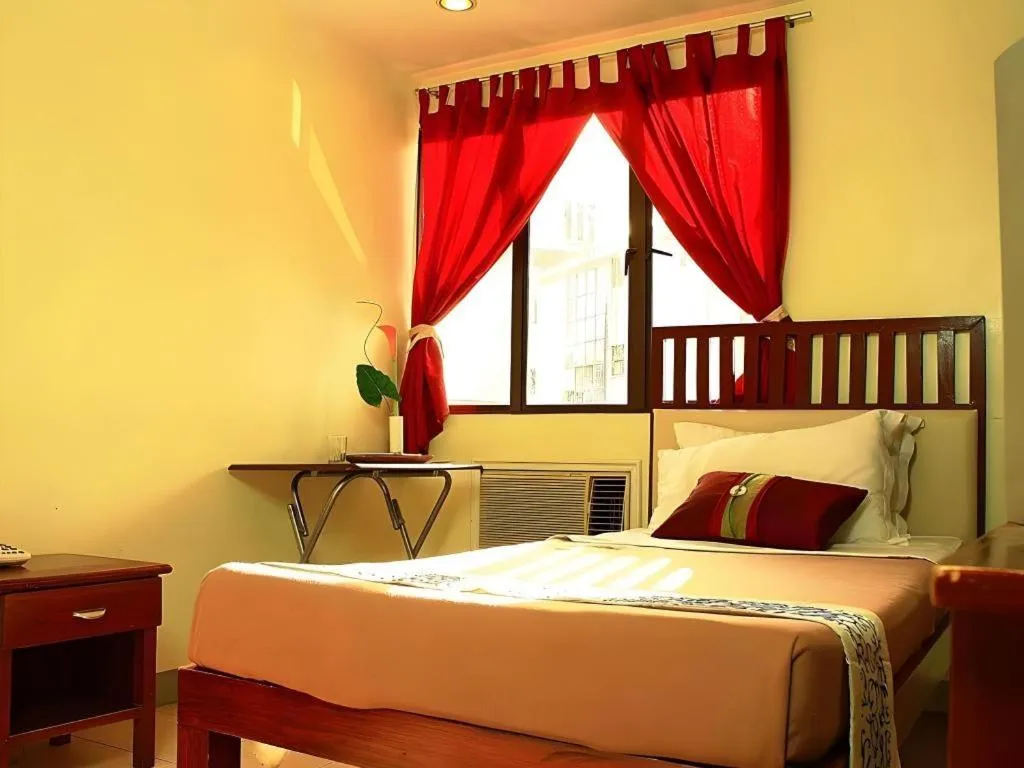 Bed in Naga Land Hotel