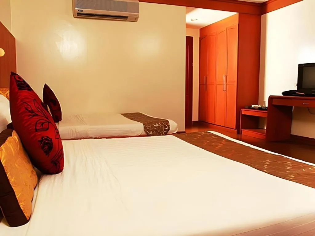 Bed in Naga Land Hotel