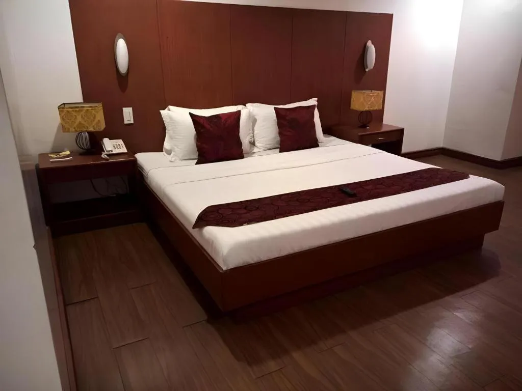 Bed in Naga Land Hotel