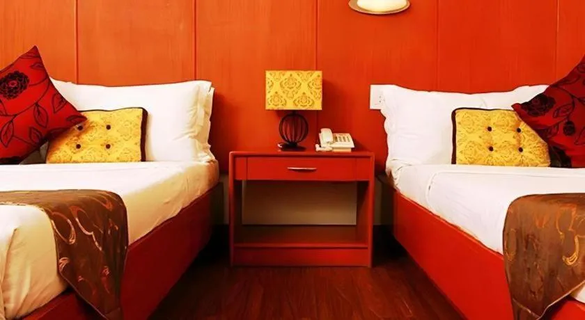 Bed in Naga Land Hotel