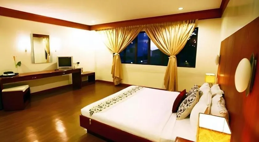 Bed in Naga Land Hotel