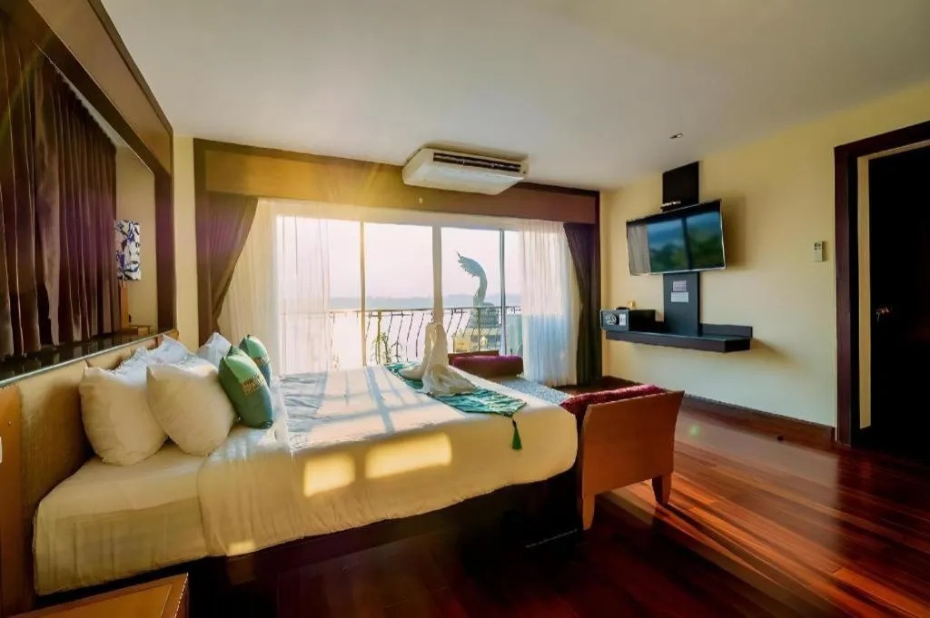 Bed in LANDMARK NAKHONPHANOM HOTEL