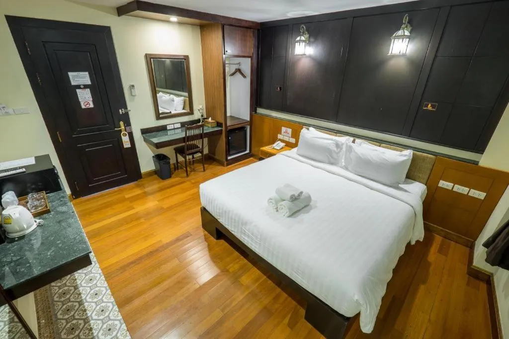 Bed in LANDMARK NAKHONPHANOM HOTEL