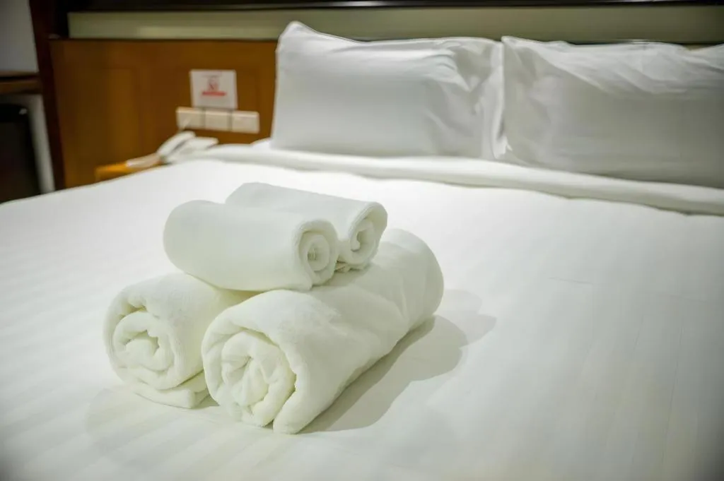 Bed in LANDMARK NAKHONPHANOM HOTEL