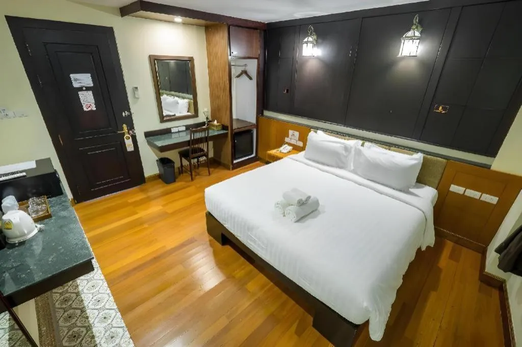 Bed in LANDMARK NAKHONPHANOM HOTEL