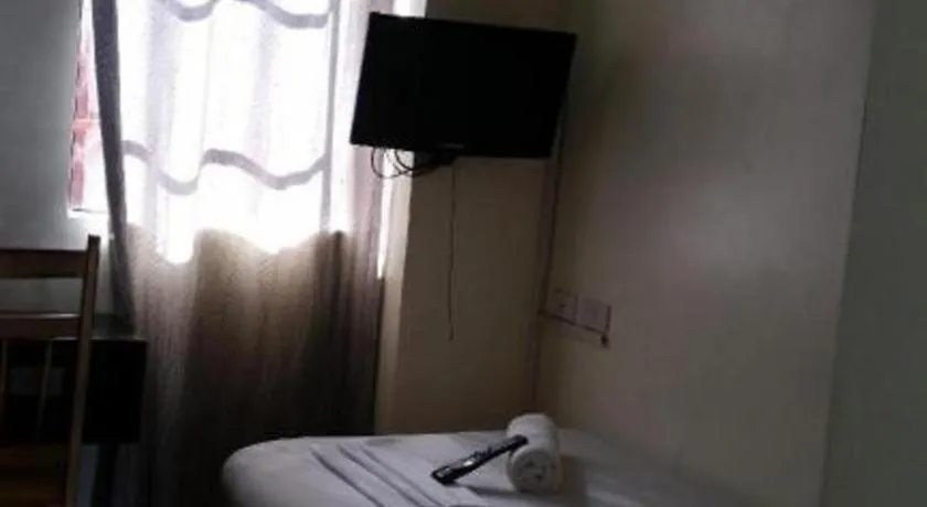 Bed in Rich Manor Pension House