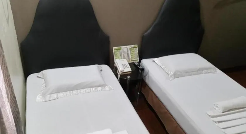 Bed in Rich Manor Pension House