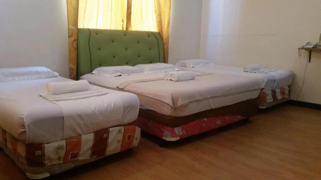 Bed in Rich Manor Pension House