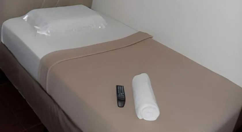 Bed in Rich Manor Pension House